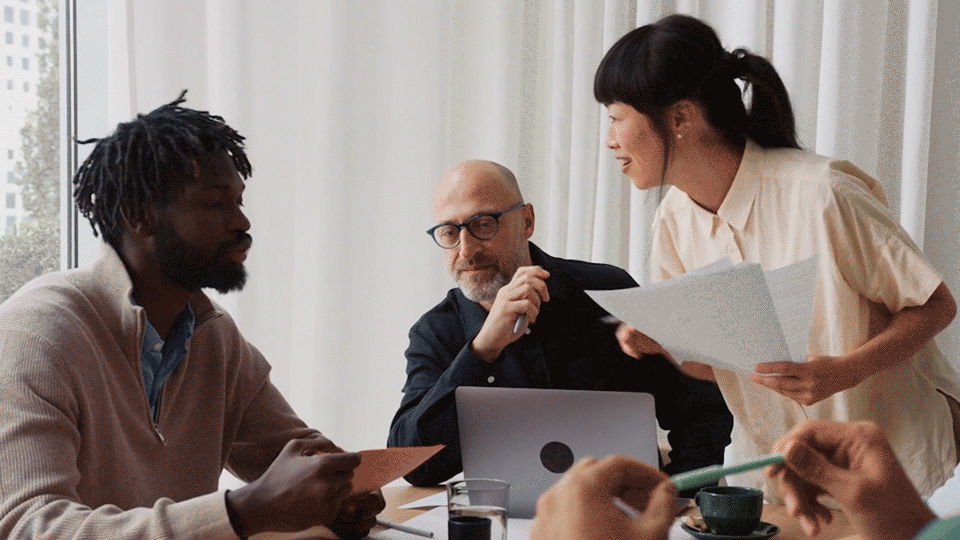 Co-workers gathered around a table