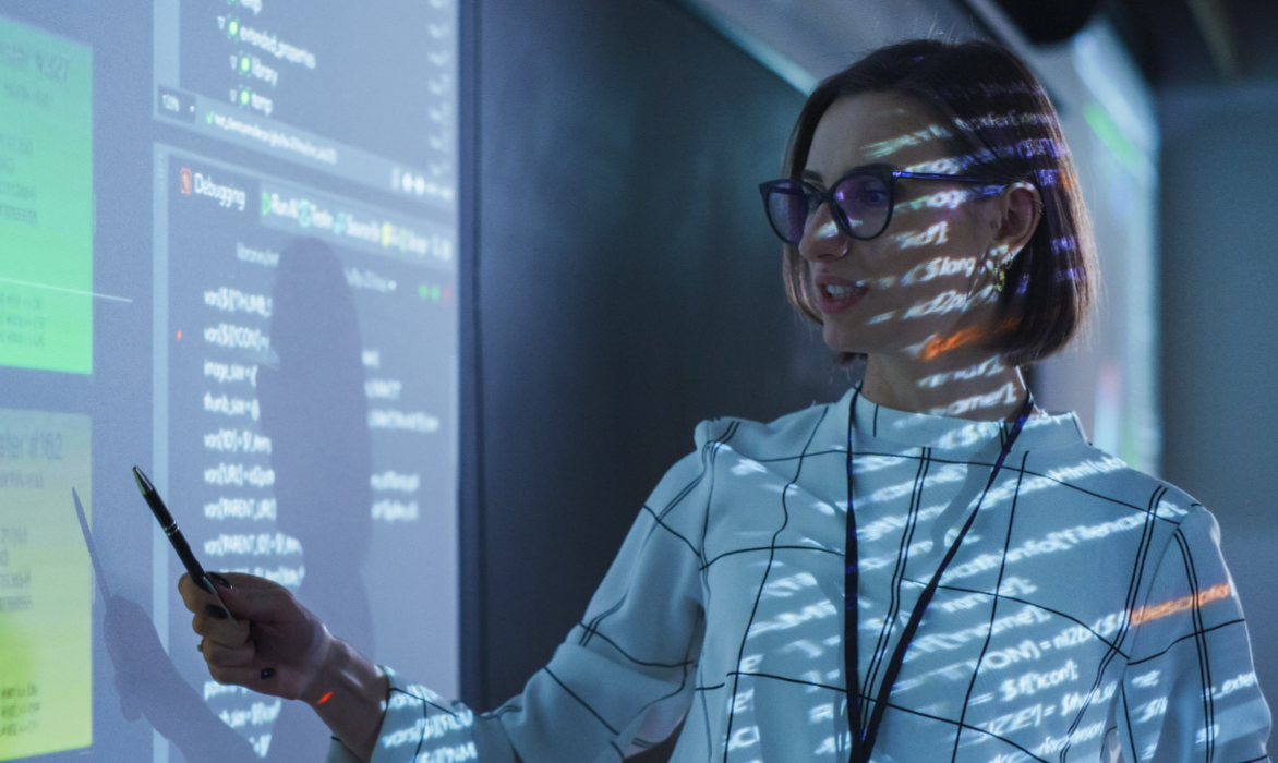 Woman training people hearing impaired people for cybersecurity.