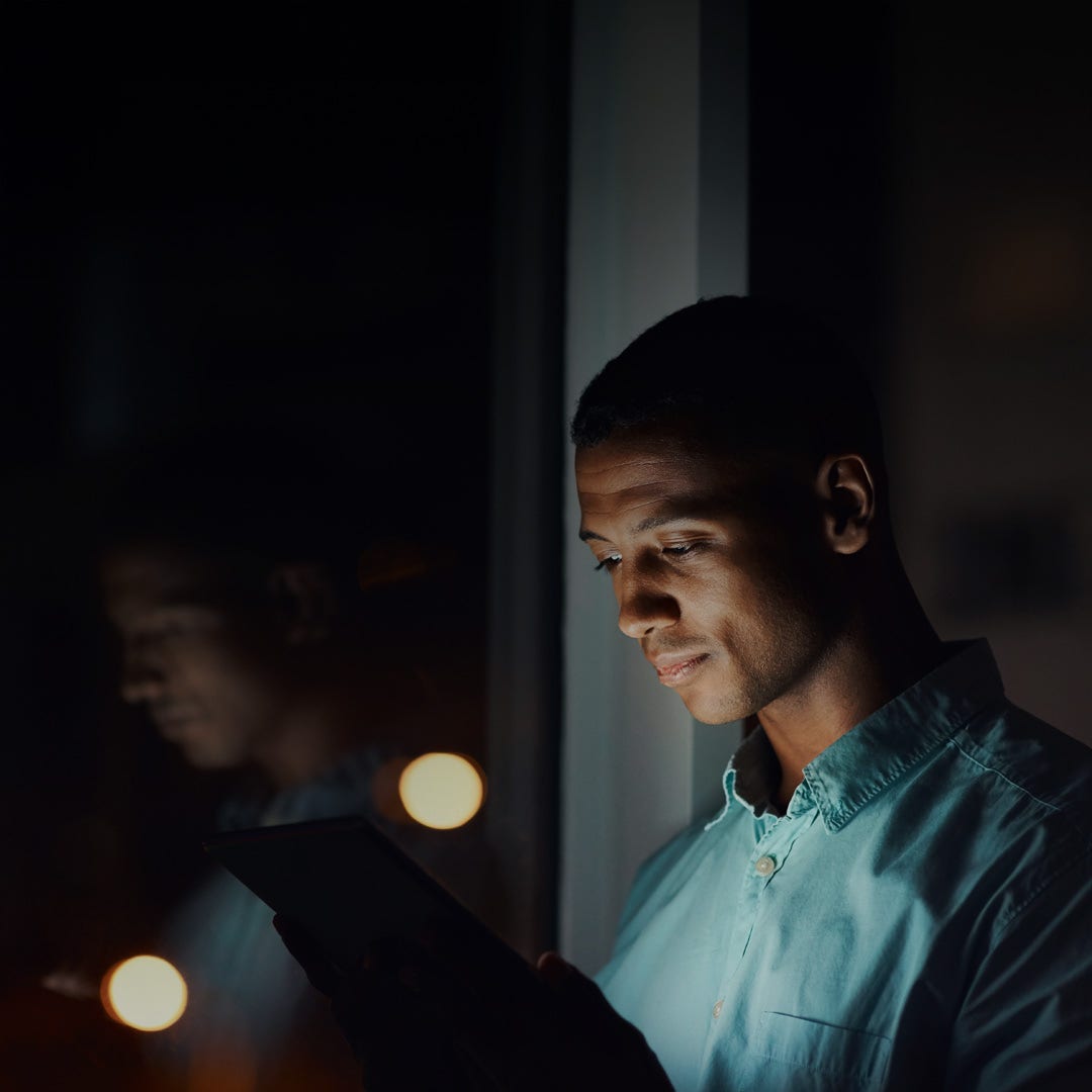 Guy looking at phone.