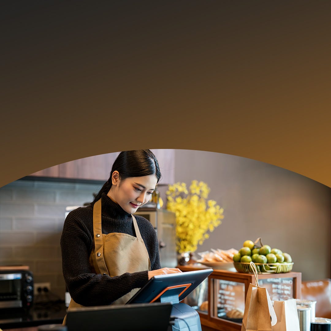 Young woman at point of sale register.
