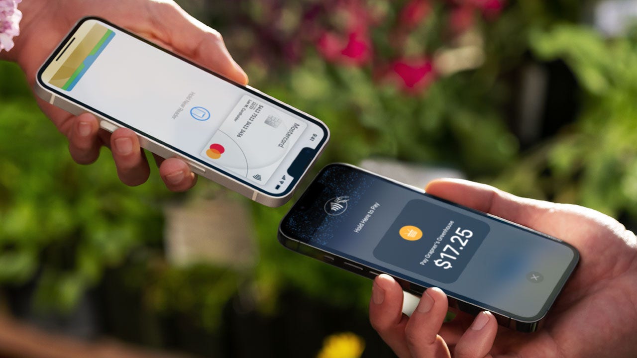 Two phones close to one another to execute payment.