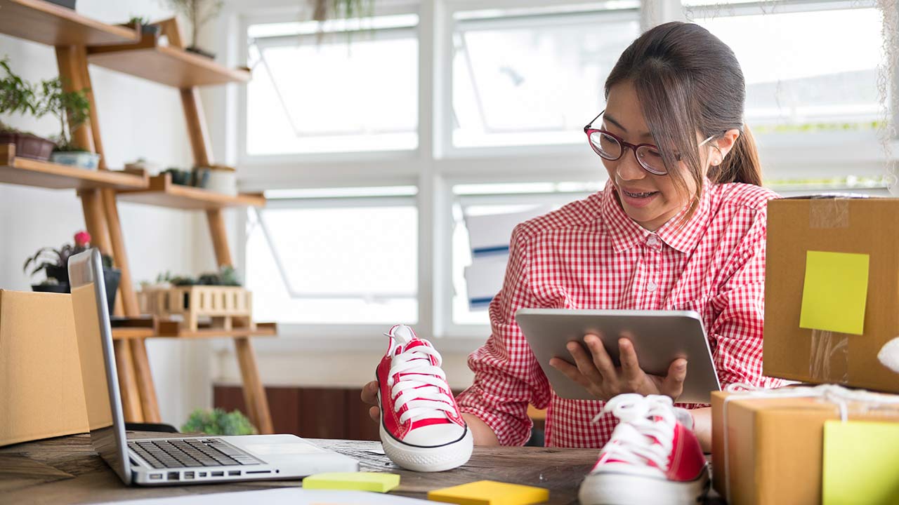 business owner working with tablet at workplace