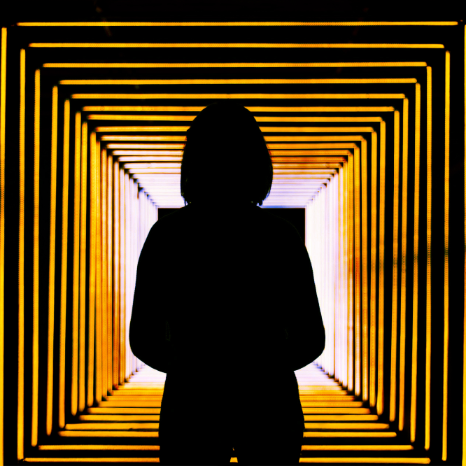 Silloutette of person in a hallway.
