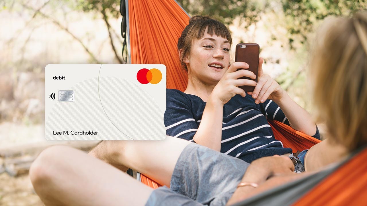 Two friends relaxing in a hammock and an image of a Mastercard debit card.