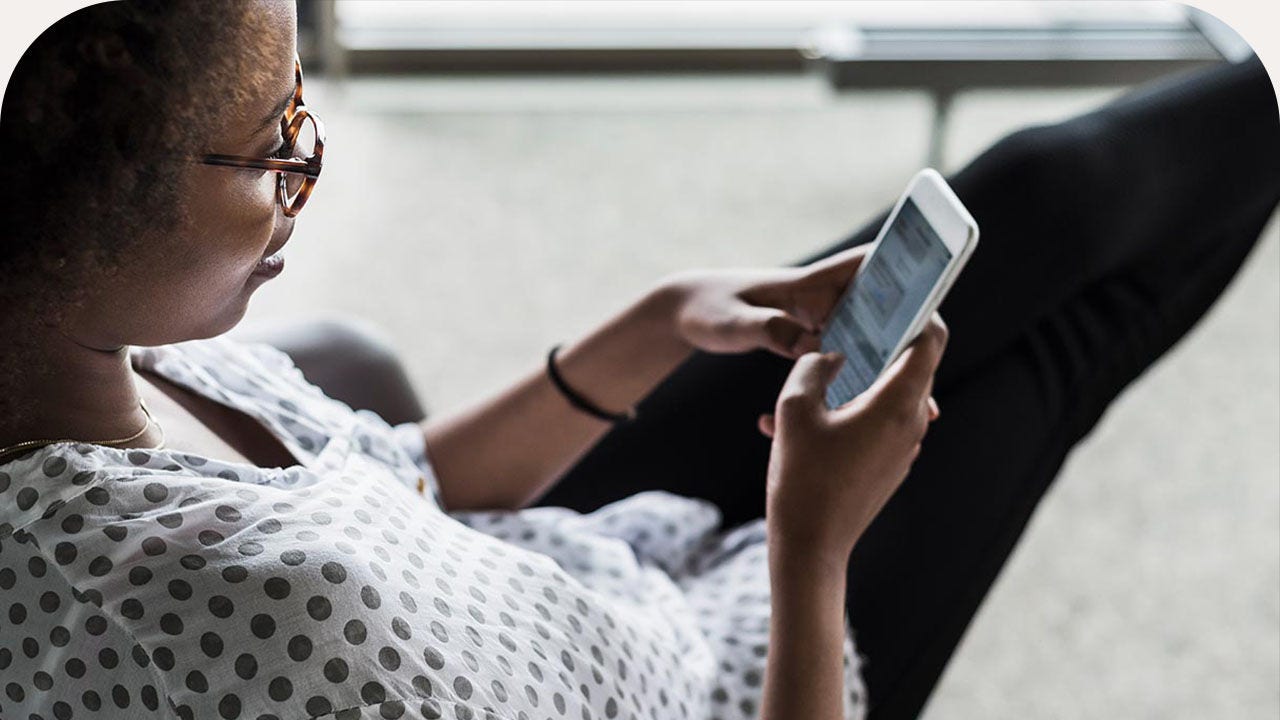 Young woman using phone