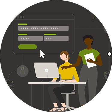 Two colleagues working together at a computer.