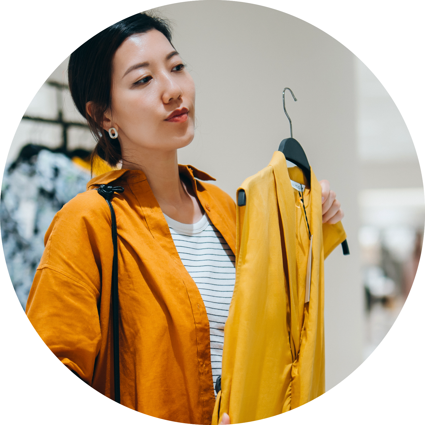woman holding yellow dress